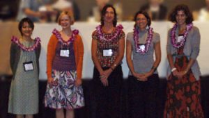 Group photo of awardees wearing leis