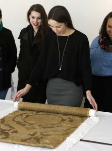 Students from Philadelphia University learning firsthand about Renaissance textiles