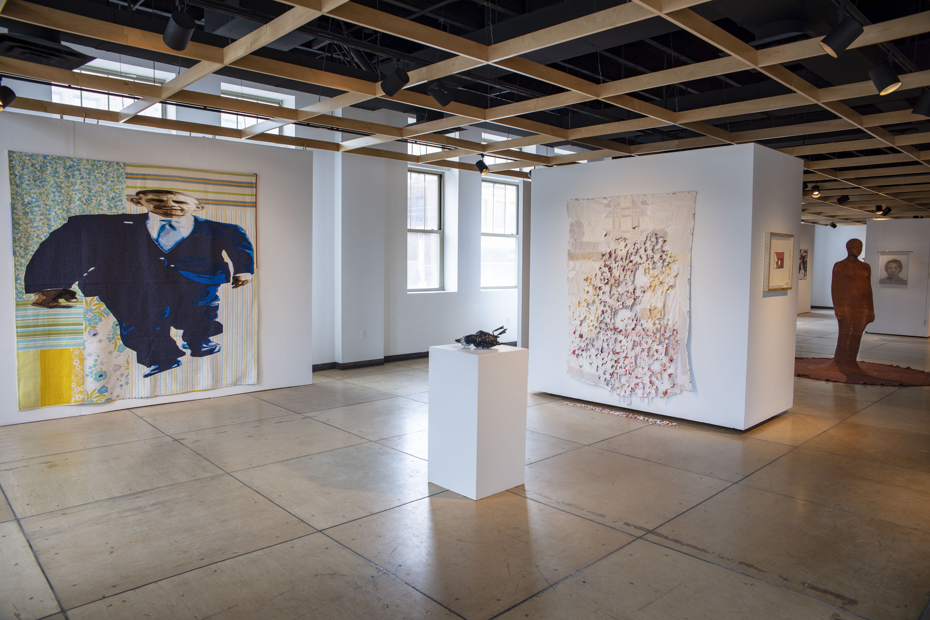 Fiberart International 2019. Contemporary Craft (left to right Luke Haynes, Sewlebrity Beth Blankenship, Oiled Eider; Marie Fornaro, It Is Bread We Fight For, But We Fight for Roses, Too; Nicole Benner, Comfort/Confine II)Photo credit: Polly Mills Whitehorn