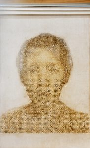 Xao Gao. Passing. (2018) Buckram. Layered images. Burning image manipulations. H28” x 20” x 1/2/” Photographed by: the artist.