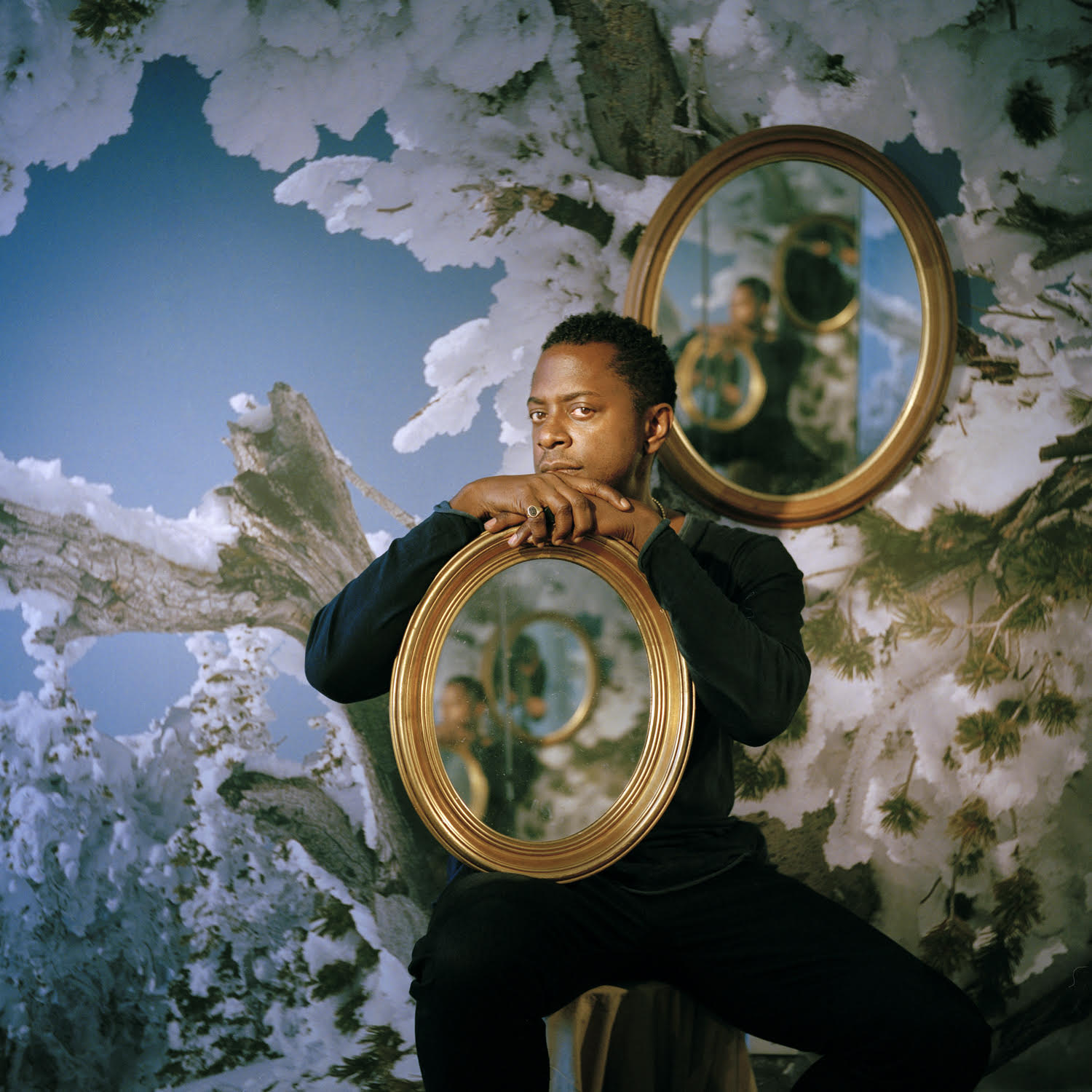 Sanford Biggers with mirrors and photographic background