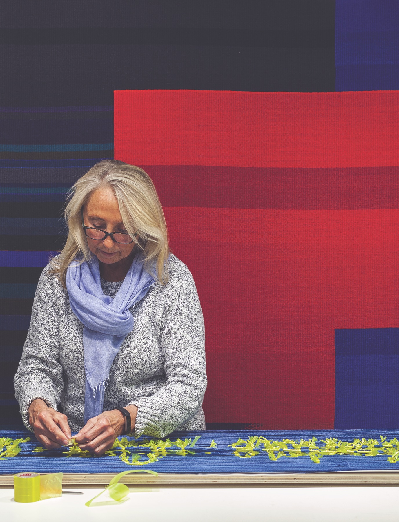 Mary Zicafoose wrapping a section of weft ikat in her studio