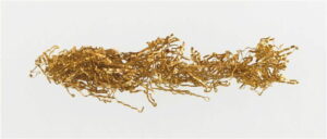 A loose pile of gold thread