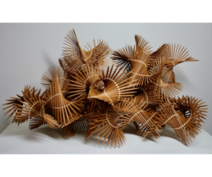 bamboo knitting needles twined together in a twirly pile